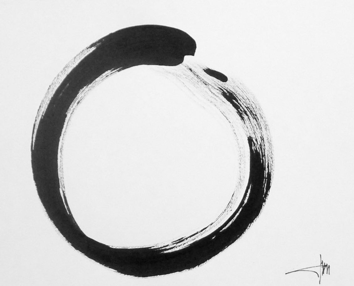 Black circular brushstroke on a white background